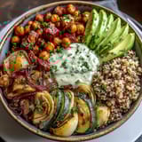 A generous drizzle of creamy tahini dressing over a wholesome, colorful bowl ready for lunch.