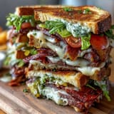 An impressive sandwich platter featuring smoked turkey, roast beef, salami, cheeses, and colorful veggies for easy self-assembly.  