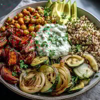 Golden roasted chickpeas and caramelized vegetables on quinoa for a vibrant Roasted Chickpea Power Bowl.